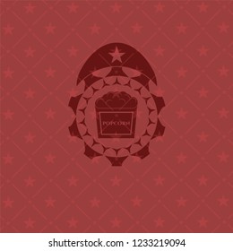 popcorn icon inside badge with red background