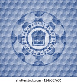 popcorn icon inside blue badge with geometric background.