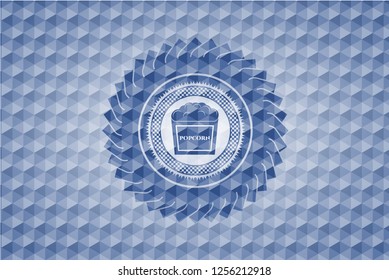 popcorn icon inside blue emblem with geometric pattern background.