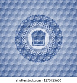popcorn icon inside blue emblem or badge with abstract geometric pattern background.