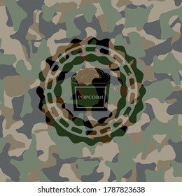 popcorn icon inside camo texture. 