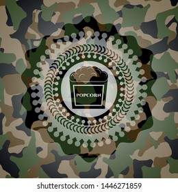 popcorn icon inside camouflage emblem