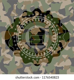 popcorn icon inside camouflage texture
