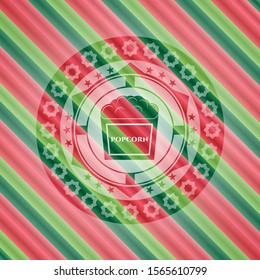 popcorn icon inside christmas emblem background.