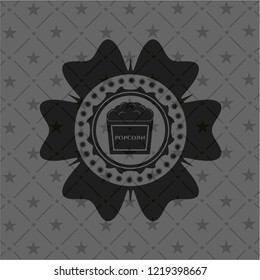 popcorn icon inside dark emblem