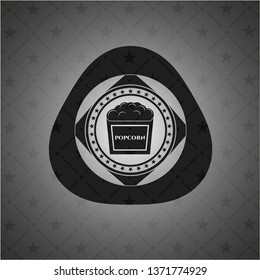 popcorn icon inside dark emblem