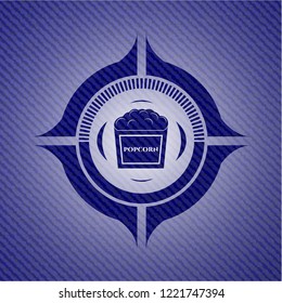 popcorn icon inside denim background