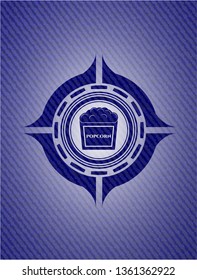 popcorn icon inside emblem with denim texture