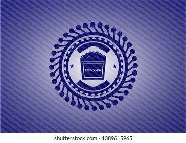 popcorn icon inside emblem with denim high quality background