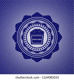popcorn icon inside emblem with jean high quality background