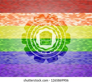 popcorn icon inside emblem on mosaic background with the colors of the LGBT flag