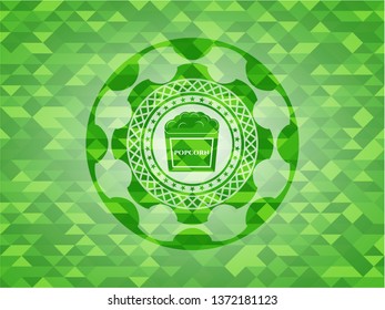 popcorn icon inside green mosaic emblem