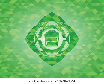 popcorn icon inside green mosaic emblem