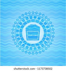 popcorn icon inside light blue water wave style badge.