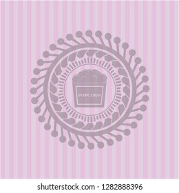 popcorn icon inside pink icon or emblem