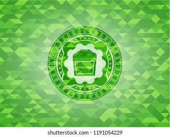 popcorn icon inside realistic green emblem. Mosaic background
