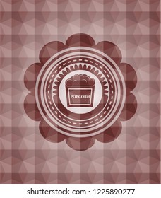 popcorn icon inside red badge with geometric background. Seamless.