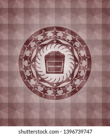 popcorn icon inside red emblem or badge with abstract geometric pattern background. Seamless.