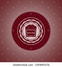 popcorn icon inside red icon or emblem