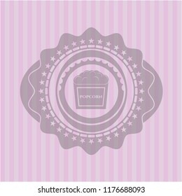 popcorn icon inside retro pink emblem