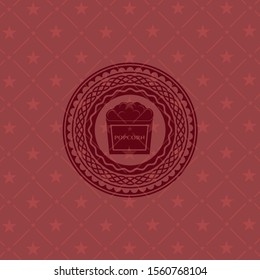 popcorn icon inside retro style red emblem