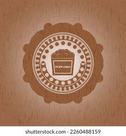 popcorn icon inside retro wood emblem. 