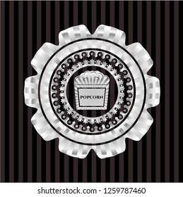 popcorn icon inside silver badge