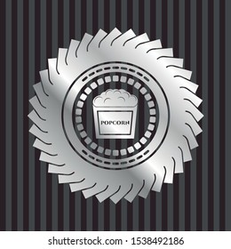 popcorn icon inside silver emblem
