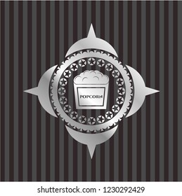 popcorn icon inside silver shiny badge
