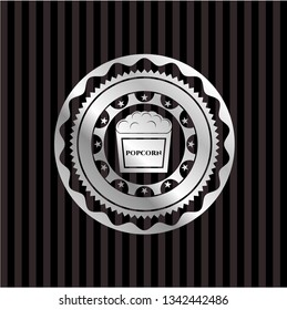 popcorn icon inside silvery emblem or badge