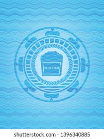 popcorn icon inside sky blue water wave badge background.