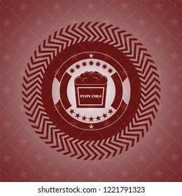 popcorn icon inside vintage red emblem