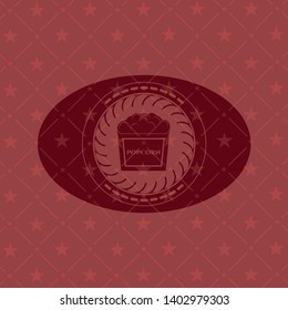 popcorn icon inside vintage red emblem