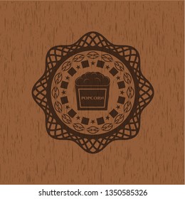 popcorn icon inside vintage wood emblem