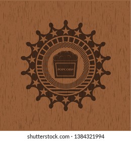 popcorn icon inside vintage wooden emblem