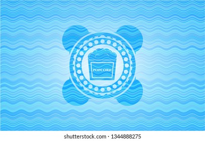 popcorn icon inside water badge background.