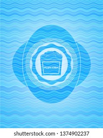 popcorn icon inside water representation style badge.