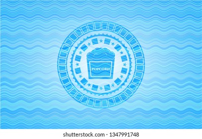 popcorn icon inside water wave representation emblem background.