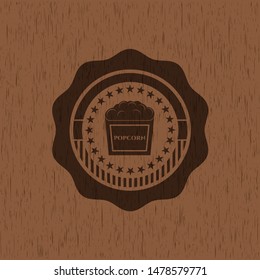 popcorn icon inside wood emblem