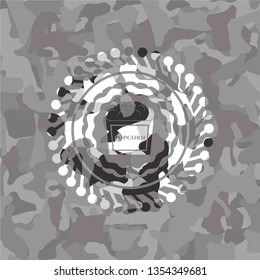 popcorn icon on grey camouflaged pattern