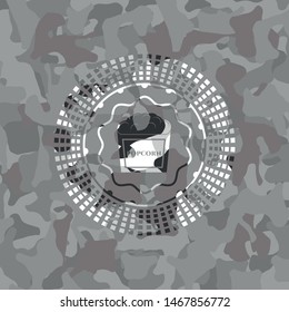 popcorn icon on grey camouflaged pattern