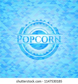 Popcorn light blue emblem. Mosaic background
