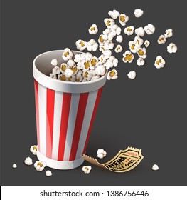 Popcorn in paper bucket. Full cup for snacks in movie theater fast food. Gold cinema ticket for film entertainment. Realistic, isolated on gray background. Eps10 vector illustration.