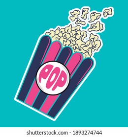 Popcorn in pink and blue striped cardboard bucket isolated on sky background
