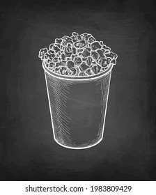 Popcorn in a plastic or paper cup. Chalk sketch on blackboard background. Hand drawn vector illustration. Retro style.