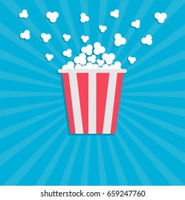 Popcorn popping. Cinema movie icon in flat design style. Red yellow strip box. Blue star burst wave background Vector illustration