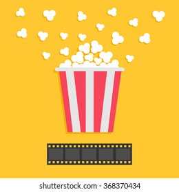 Popcorn popping. Film strip. Red yellow box. Cinema movie night icon in flat design style. Yellow background. Vector illustration