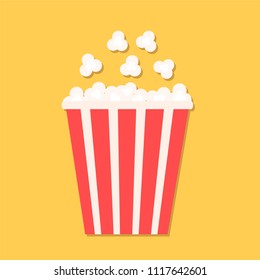 Popcorn in red paper cup. Cinema icon in flat dsign style