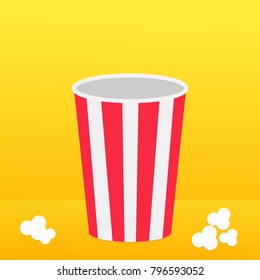 Popcorn round box standing on the surface. Movie Cinema icon in flat design style. Pop corn popping. Yellow gradient background. Fast food. Vector illustration