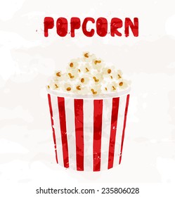 Popcorn in striped bucket on white background